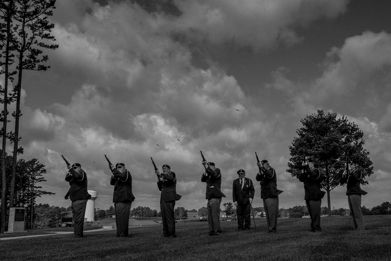 Seven American Legion members firing their guns as a salute at the Southwest Virginia Veterans Cemetery