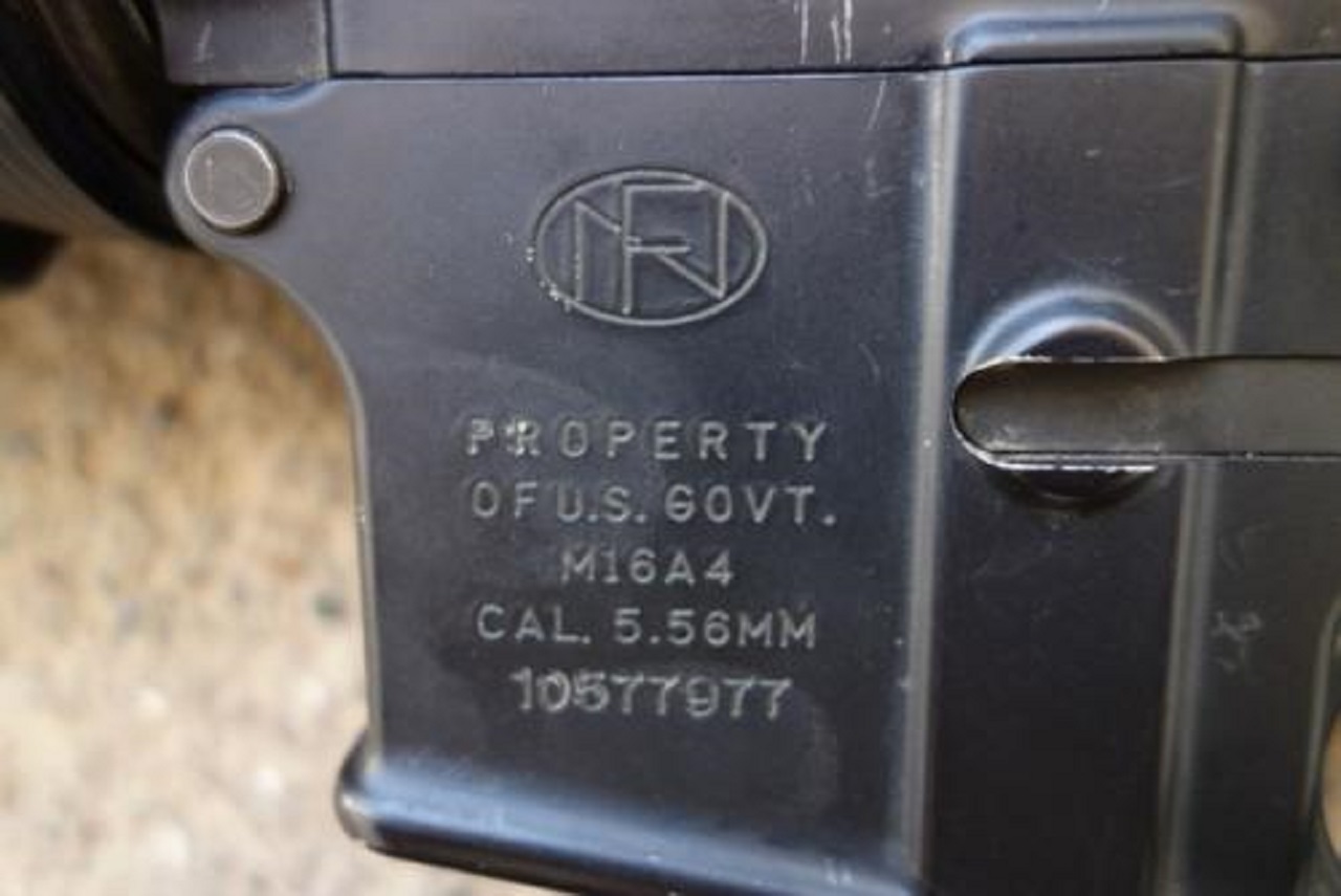 Close up of engravings on an M16A4 rifle’s magazine clip with the words ‘property of  U.S. Govt.’ and serial number